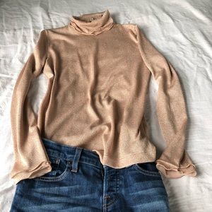 Dress up jeans with rose/gold shimmer turtleneck.